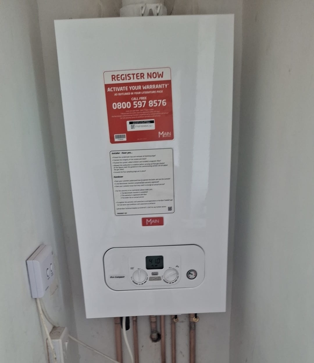 Newly installed Main Eco Compact boiler with warranty registration label