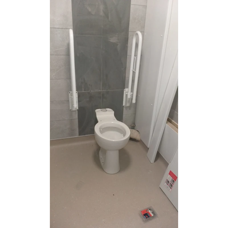 Accessible toilet fit with grab rails, commercial bathroom